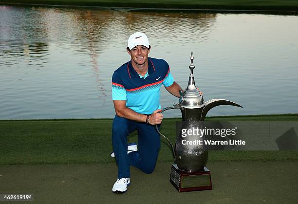Rory McIlroy of Northern Ireland poses with the trhophy after winning the Omega Dubai Desert Classic on the Majlis Course at the Emirates Golf Club...