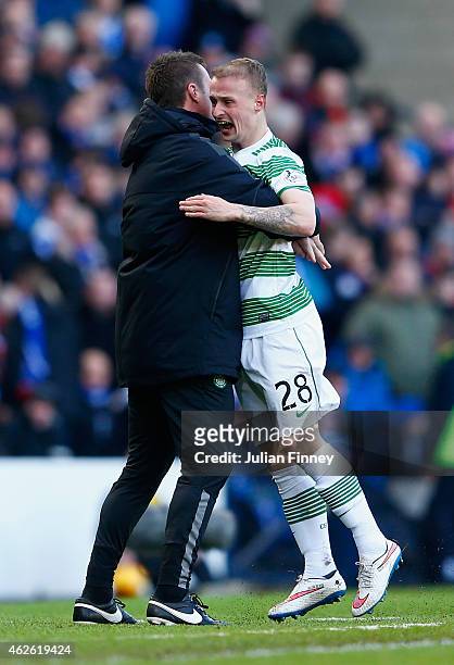 Leigh Griffiths of Celtic celebrates scoring the opening goal with Manager Ronny Deila of Celtic during the Scottish League Cup Semi-Final between...