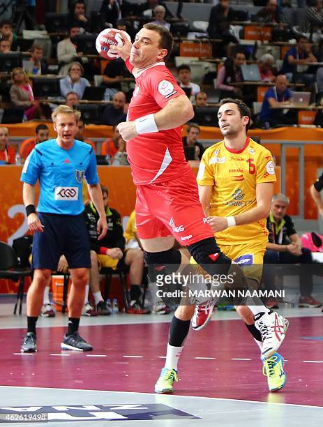 Poland's Bartosz Jurecki attempts a shot on goal during the 24th Men's Handball World Championships 3rd place match between Spain and Poland at the...