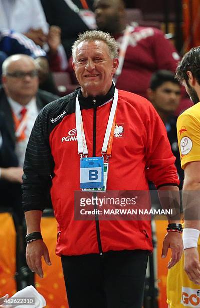 Poland's coach Michael Biegler smiles during the 24th Men's Handball World Championships 3rd place match between Spain and Poland at the Lusail...