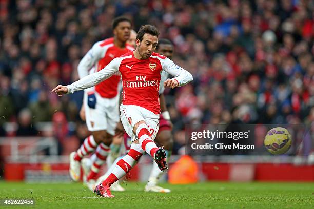 Santi Cazorla of Arsenal scores his team's fourth goal from the penalty spot during the Barclays Premier League match between Arsenal and Aston Villa...