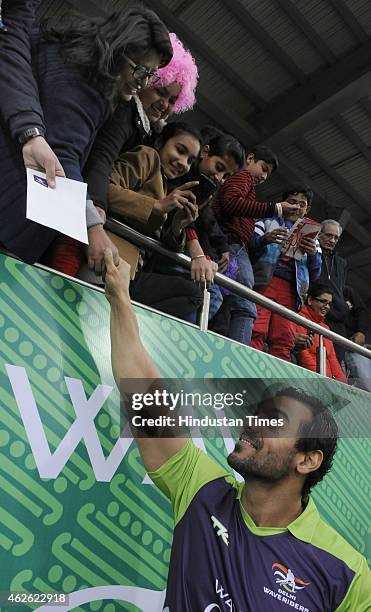 Bollywood actor John Abraham meets with people during a match between Delhi Waveriders and Dabang Mumbai during the Hero Hockey India League at Major...