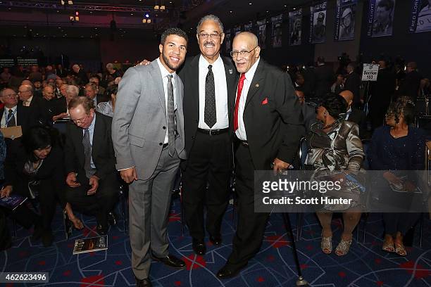 Darrell Wallace Jr., driver of the Ford, Franklin Scott and Wendell Scott Jr., son's of NASCAR Hall of Famer Wendell Scott, pose for a photo prior to...