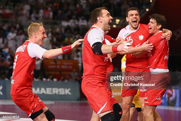 Adam Wisniewski, Bartosz Jurecki, Michal Jurecki and Piotr Chrapkowski of Poland celebrate after the third place match between Poland and Spain in...