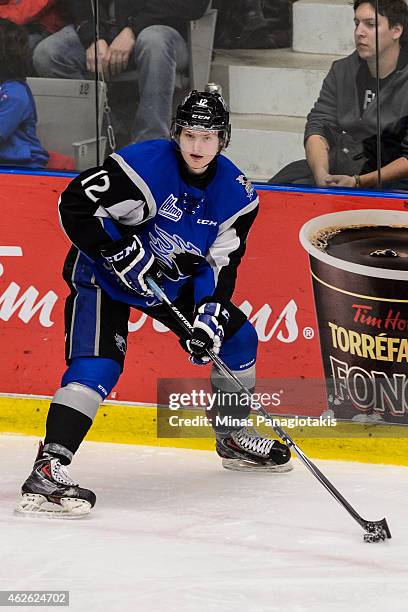 Adam Marsh of the Saint John Sea Dogs looks to play the puck during the QMJHL game against the Blainville-Boisbriand Armada at the Centre Excellence...