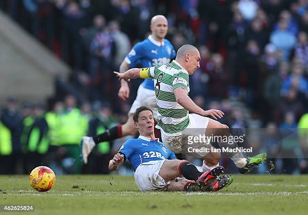 Celtic's captain Scott Brownis tackled by Rangers Ian Black during the Scottish League Cup Semi-Final football match between Celtic and Rangers at...