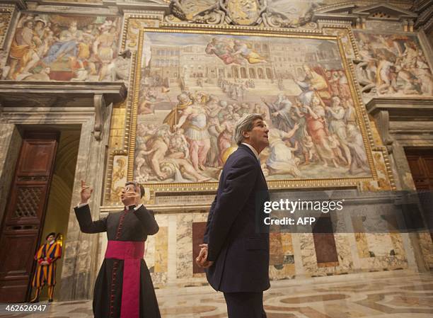 Secretary of State John Kerry visits a section of the Vatican apostolic palace with the chief of Protocol Msgr. Jose Avelino Bettencourt after a...