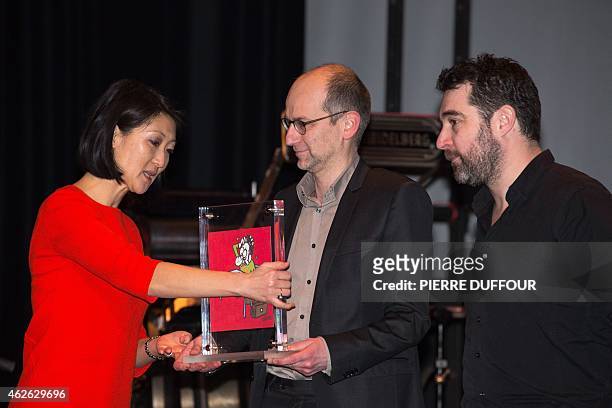 French cartoonist Christian Hincker receives the "Grand Prix Charlie de la liberte d'expression" award on behalf of late French cartoonists Cabu,...