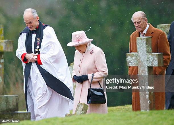 The Reverend Canon Jonathan Riviere, Queen Elizabeth II and Prince Philip, Duke of Edinburgh attend Sunday service at the church of St Peter and St...