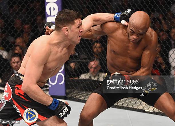 Nick Diaz punches Anderson Silva of Brazil in their middleweight bout during the UFC 183 event at the MGM Grand Garden Arena on January 31, 2015 in...