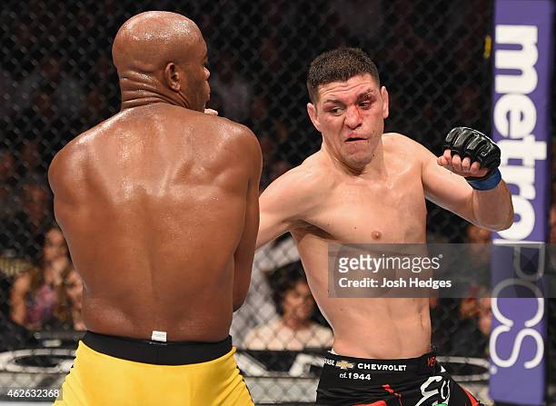 Nick Diaz punches Anderson Silva of Brazil in their middleweight bout during the UFC 183 event at the MGM Grand Garden Arena on January 31, 2015 in...