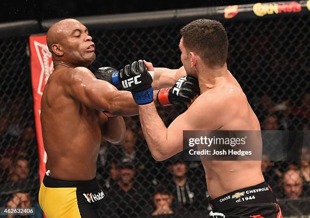 Anderson Silva of Brazil and Nick Diaz trade punches in their middleweight bout during the UFC 183 event at the MGM Grand Garden Arena on January 31,...