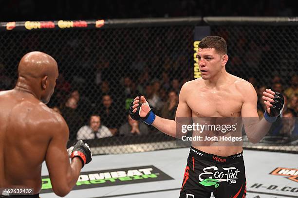 Nick Diaz taunts Anderson Silva of Brazil in their middleweight bout during the UFC 183 event at the MGM Grand Garden Arena on January 31, 2015 in...