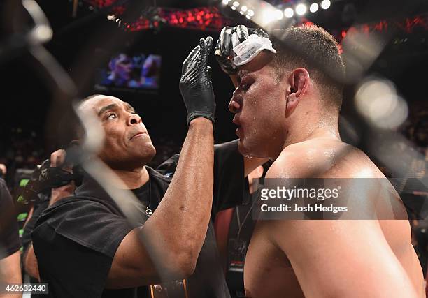 Nick Diaz is treated in his corner between rounds of his middleweight bout against Anderson Silva of Brazil during the UFC 183 event at the MGM Grand...
