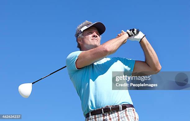 admiring a good drive - male golfer stock pictures, royalty-free photos & images