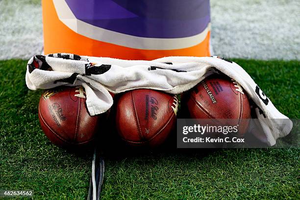 Footballs sit near a goal post prior to Super Bowl XLIX between the New England Patriots and the Seattle Seahawks at University of Phoenix Stadium on...
