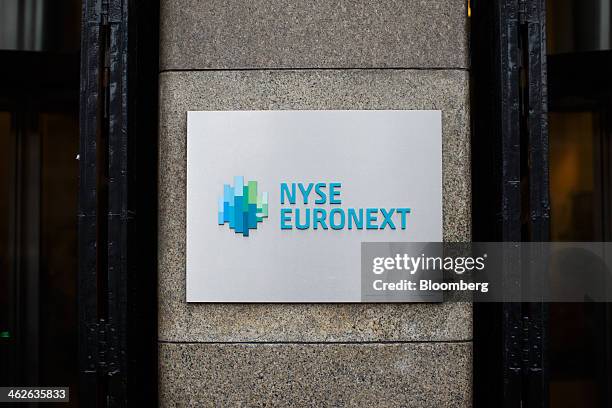 The NYSE Euronext logo, a unit of IntercontinentalExchange Group Inc. , sits on a sign outside the Amsterdam Stock Exchange, in Amsterdam,...