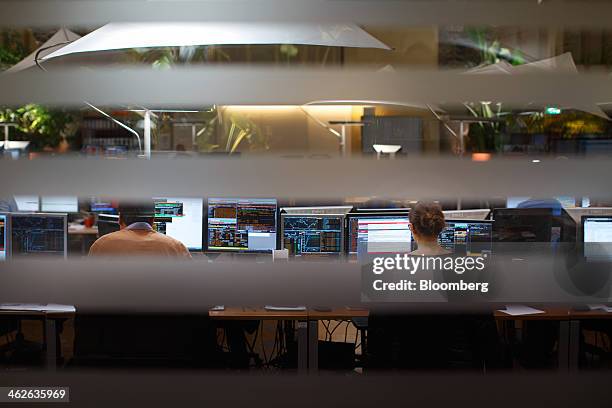 Financial traders monitor data on computer screens at the Amsterdam Stock Exchange, operated by Euronext NV, a unit of IntercontinentalExchange Group...