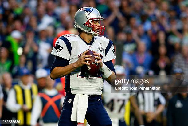 Tom Brady of the New England Patriots throws the ball against the Seattle Seahawks in the first quarter during Super Bowl XLIX at University of...