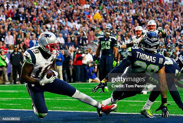 Brandon LaFell of the New England Patriots scores a touchdown over Earl Thomas of the Seattle Seahawks in the second quarter during Super Bowl XLIX...