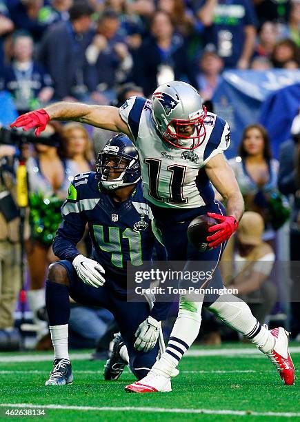 Julian Edelman of the New England Patriots reacts after making a catch over Byron Maxwell of the Seattle Seahawks in the second quarter during Super...