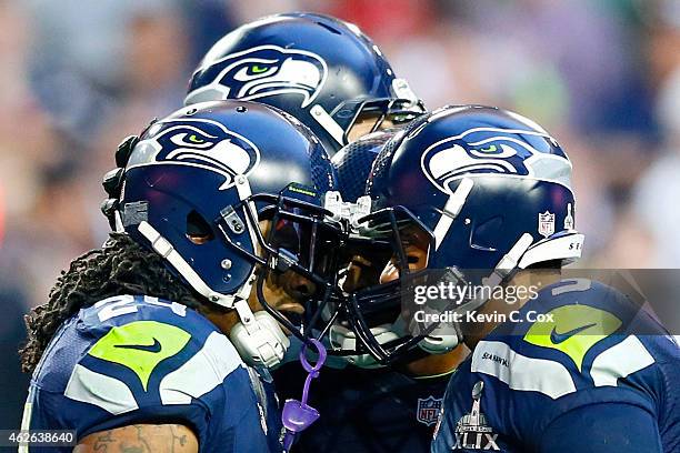 Marshawn Lynch and Russell Wilson of the Seattle Seahawks celebrate after a three yard touchdown by Lynch in the second quarter against the New...