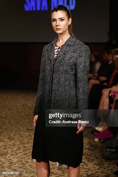 Model walks the runway at the Sava Nald show during the Mercedes-Benz Fashion Week Autumn/Winter 2014/15 at Hotel Adlon on January 14, 2014 in...