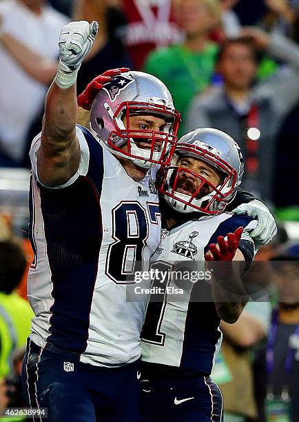 Rob Gronkowski and Julian Edelman of the New England Patriots celebrate after Gronkowski scored a 22 yard touchdown against the Seattle Seahawks in...