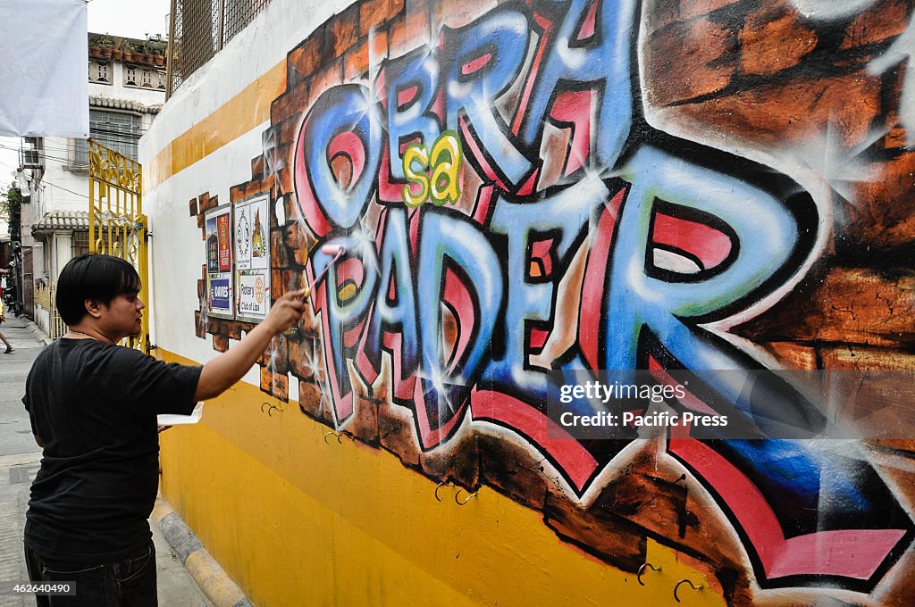 An artist apply finishing touches in his mural painting...