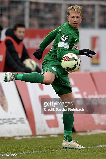 Kevin Schoeneberg of Muenster controls the ball during the 3. Liga match between Preussen Muenster and Dynamo Dresden at Preussenstadion on February...