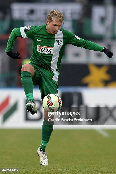 Kevin Schoeneberg of Muenster controls the ball during the 3. Liga match between Preussen Muenster and Dynamo Dresden at Preussenstadion on February...