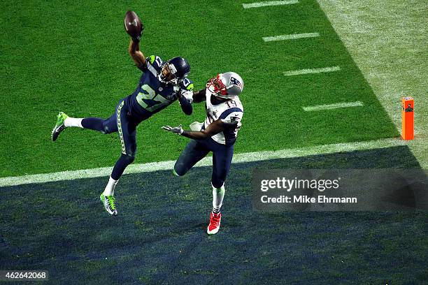 Brandon LaFell of the New England Patriots fails to complete the catch against Tharold Simon of the Seattle Seahawks in the fourth quarter during...