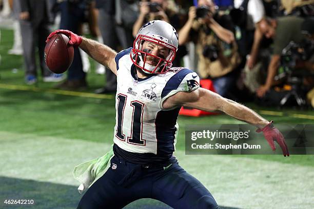 Julian Edelman of the New England Patriots celebrates as he scores a 3 yard touchdown in the fourth quarter against Seattle Seahawks during Super...