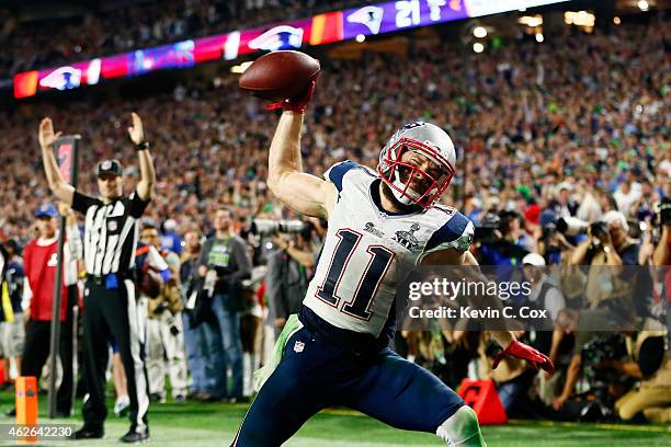 Julian Edelman of the New England Patriots celebrates as he scores a 3 yard touchdown in the fourth quarter against Seattle Seahawks during Super...