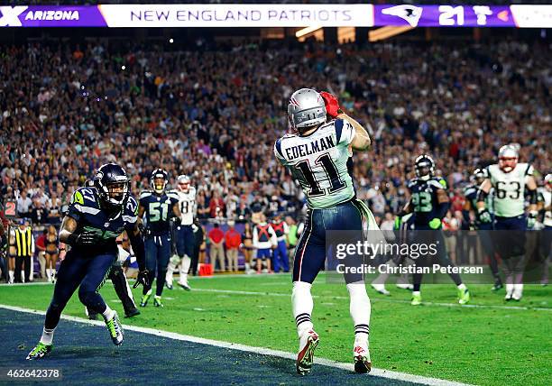 Julian Edelman of the New England Patriots scores a touchdown against the Seattle Seahawks in the fourth quarter during Super Bowl XLIX at University...