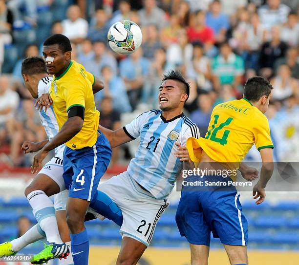 Marlon of Brazil, Joaquín Ibañez and Rodrigo Moreira of Argentina and Nathan of Brazil , during a match between Argentina and Brazil as part of South...