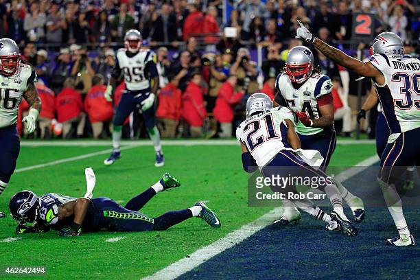 Malcolm Butler of the New England Patriots intercepts a pass by Russell Wilson of the Seattle Seahawks late in the fourth quarter during Super Bowl...