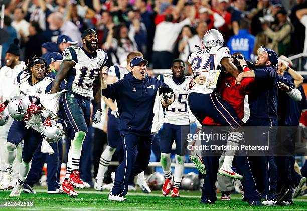 Darrelle Revis and Brandon LaFell of the New England Patriots react after an interception against the Seattle Seahawks in the fourth quarter during...