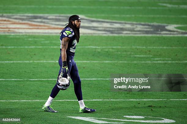 Richard Sherman of the Seattle Seahawks looks on late in the game against the New England Patriots during Super Bowl XLIX at University of Phoenix...