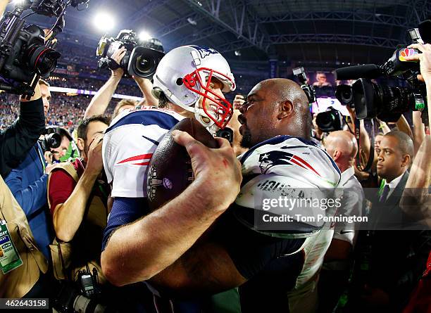 Tom Brady and Vince Wilfork of the New England Patriots celebrate after defeating the Seattle Seahawks 28-24 to win Super Bowl XLIX at University of...