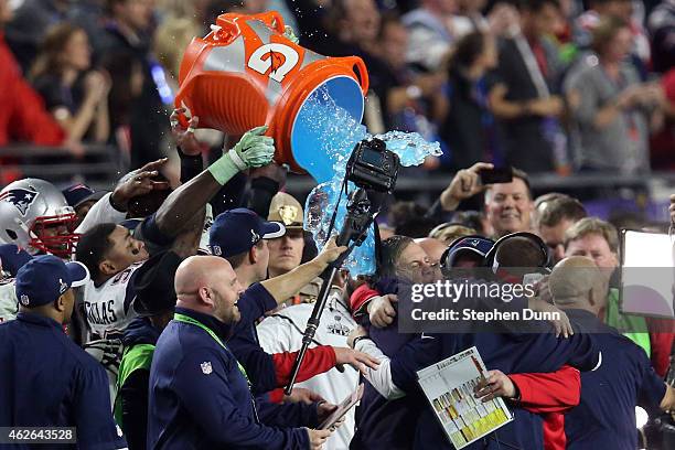 The New England Patriots celebrate late in the game with head coach Bill Belichick of the New England Patriots against the Seattle Seahawks during...