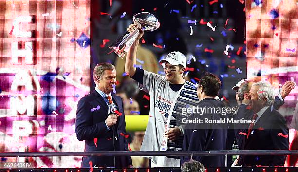 Tom Brady of the New England Patriots holds the Vince Lombardi Tropy after winning Super Bowl XLIX over the Seattle Seahawks 28-24 at University of...