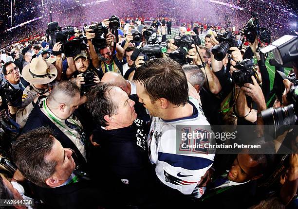 Tom Brady of the New England Patriots celebrates with head coach Bill Belichick after defeating the Seattle Seahawks 28-24 during Super Bowl XLIX at...