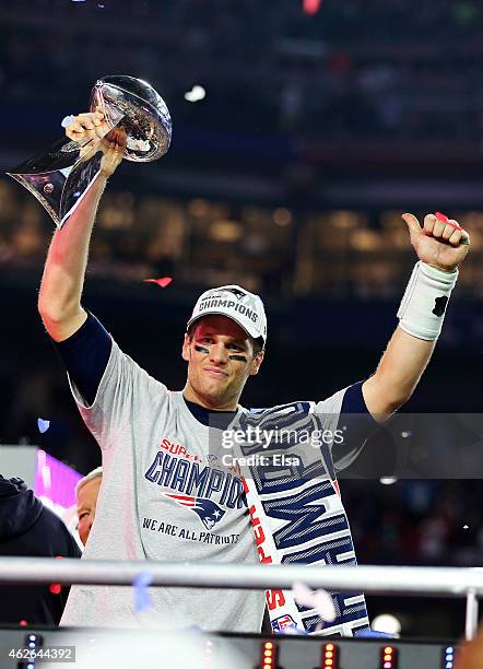 Tom Brady of the New England Patriots celebrates with the Vince Lombardi Trophy after defeating the Seattle Seahawks 28-24 to win Super Bowl XLIX at...