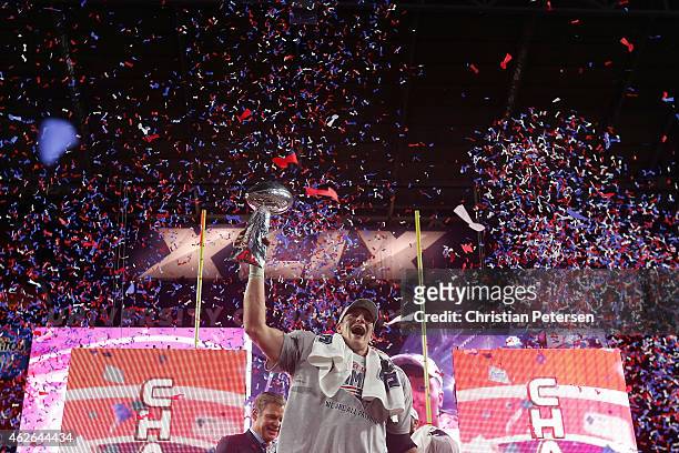 Rob Gronkowski of the New England Patriots celebrates with the Vince Lombardi Trophy at the trophy ceremony after defeating the Seattle Seahawks...