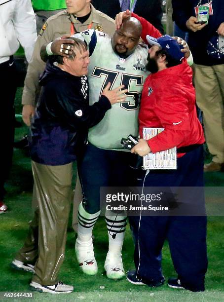 Head coach Bill Belichick of the New England Patriots, Vince Wilfork of the New England Patriots and New England Patriots Defensive Coordinator Matt...
