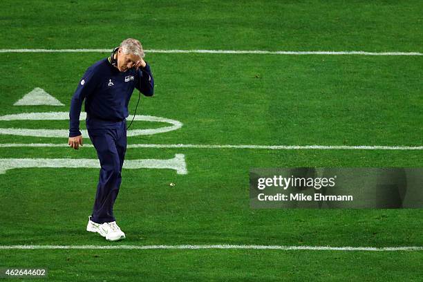 Head coach Pete Carroll of the Seattle Seahawks looks dejected after defeat to the New England Patriots during Super Bowl XLIX at University of...