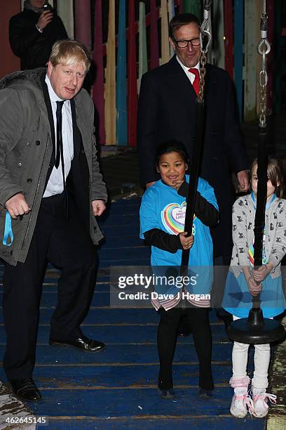 Boris Johnson and Richard Desmond attend a photocall at The Shadwell Community Project on January 14, 2014 in London, England.