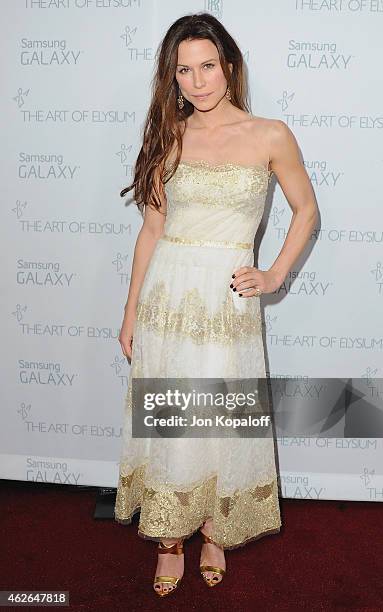 Actress Rhona Mitra arrives at The Art Of Elysium 8th Annual Heaven Gala at Hangar 8 on January 10, 2015 in Santa Monica, California.