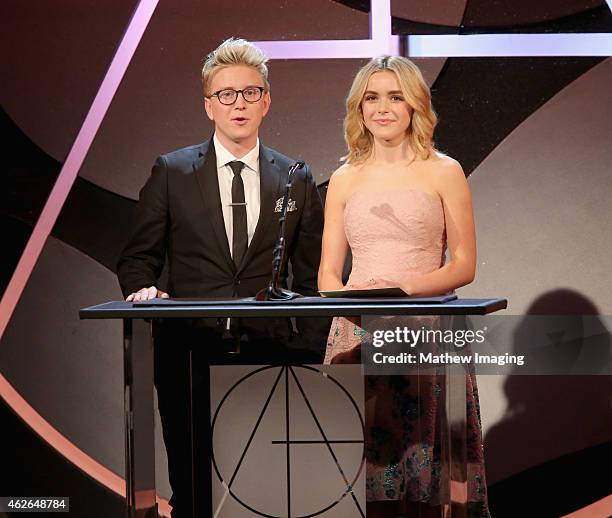 Presenters Tyler Oakley and Kiernan Shipka speak onstage during the 19th Annual Art Directors Guild Excellence In Production Design Awards at The...